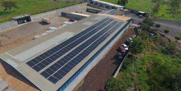 Solar panels covering an industrial factory roof, illustrating the manufacturing and supply chain affected by China's proposed solar technology export controls