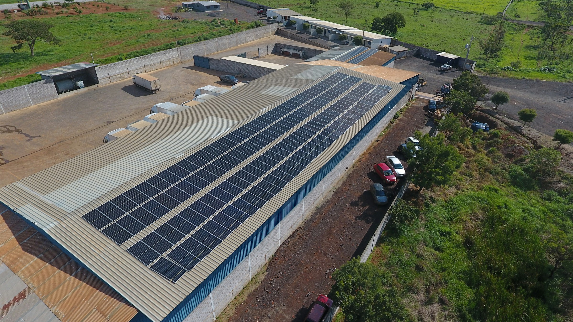 Solar panels covering an industrial factory roof, illustrating the manufacturing and supply chain affected by China's proposed solar technology export controls